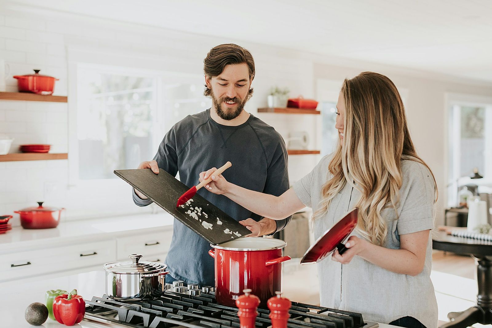 A family cooking together in a remodeled Tell Projects kitchen